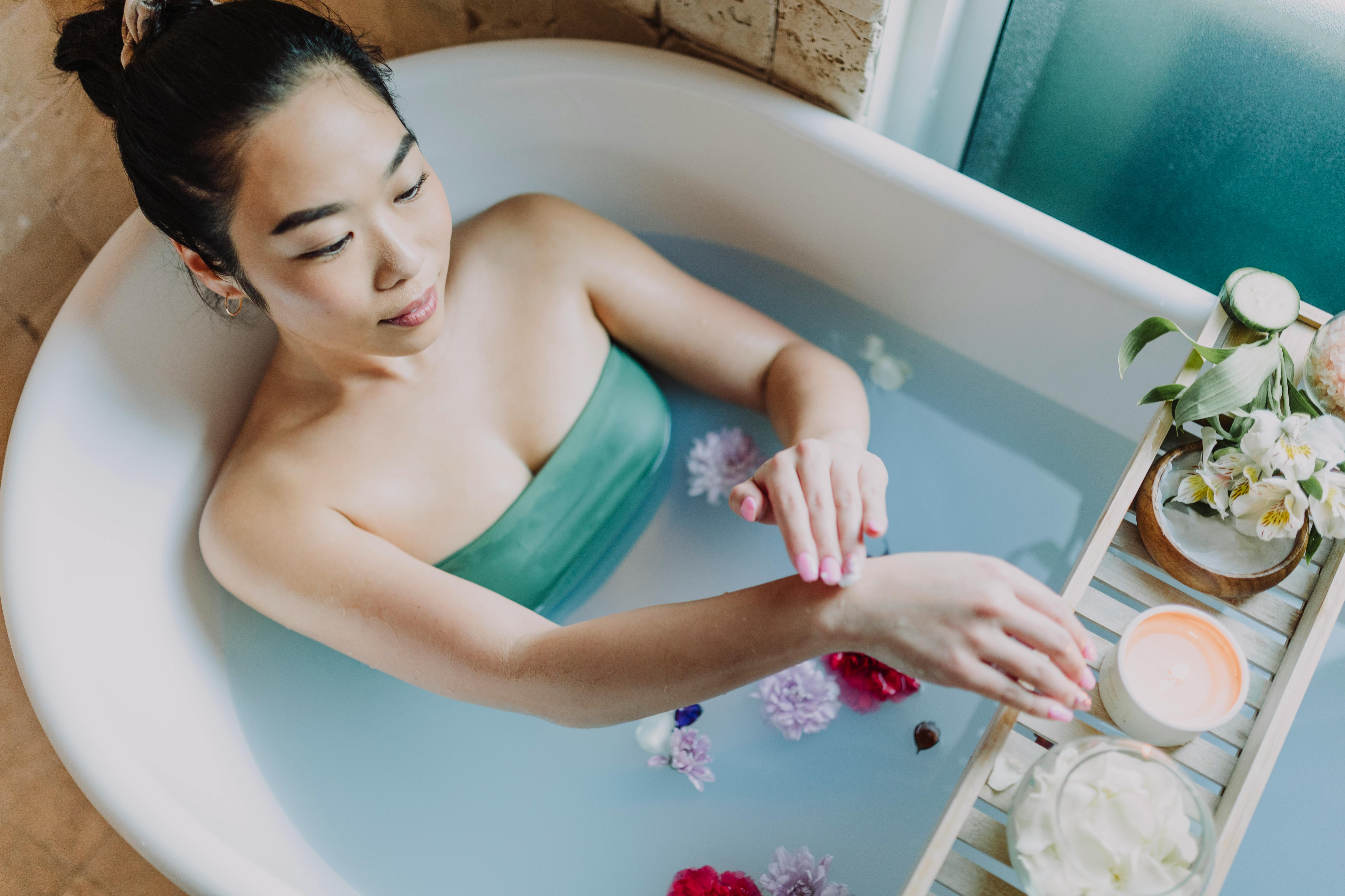 Woman having a luxurious bath for self-care